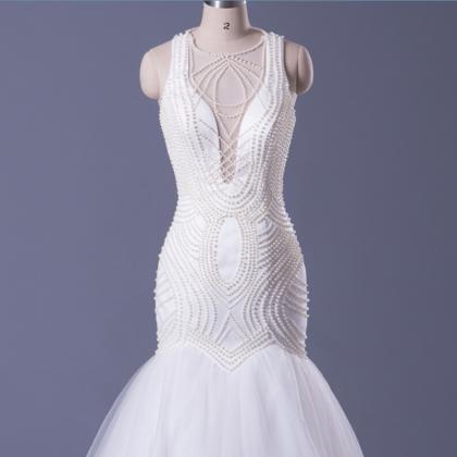 Sheer Plunging Beaded Mermaid Wedding Dress..